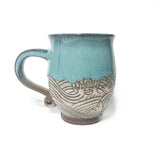 Tasse à anse motif vagues